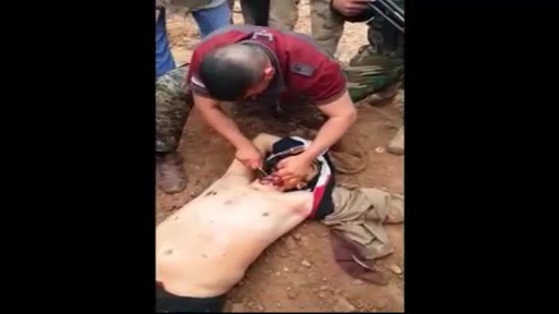 Iraqi soldiers beheading dead ISIS fighter