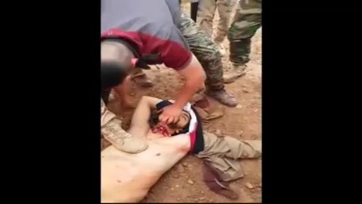 Iraqi soldiers beheading dead ISIS fighter