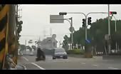Motorcyclist ignores the speeding car and pays the price