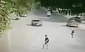 Guy crossing the road gets hit by a car