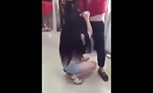 Chinese girl fights topless in market