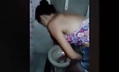 Crazy woman drinking from toilet