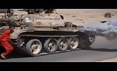 Man being run over by a tank