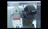 Idiot burned by fire when spaying fuel at gas station guy