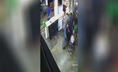 Terrified lady watches her business getting looted