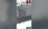 Criminal being beaten by horde