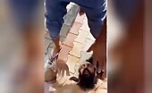 Man being beaten by crowd