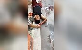 Chinese man survivor of severe mishap lying on the ground.