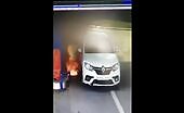 Absolute halfwit makes use of a lighter at a gasoline stations