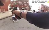 Baltimore police officer shoots male holding a female at knifepoint theyn