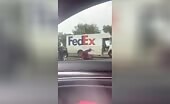 Fedex vehicle driver dove and also stomped through his colleagues in a parkin