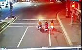 An auto knocked down 3 motorcyclists standing up at a website traffic