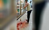 Crazy female tries to cut her own throat in a grocery store u.