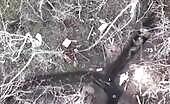Explosive hops off the safety helmet of a ru soldier in a trench t.
