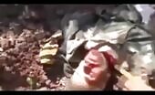 Taliban viewed off the scalp of a lifeless syrian soldier along with a saw