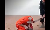 ISIS Beheading- Head Hanging By Skin 