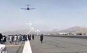 Afghans climb a plane and fall from the aircraft