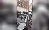 Aftermath of guy jumping from a building and landing on a ca