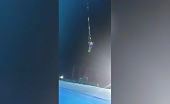 Beginner trapeze artist slips out of her partners grip and f.