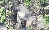 Ukrainian drones attack Russian MT-LB with grenades