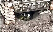 Ukrainian soldier throws grenade under tank with Russian soldier