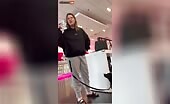 Woman walks into T-Mobile store
