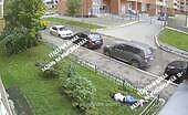 Woman jumps from 11th floor, lands on lawn fence