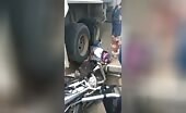 Female motorcyclist crushed by truck wheels ide