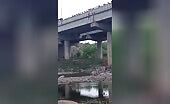 Boy jumps from bridge in India