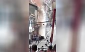 Burning Building Roof Collapse Injures People