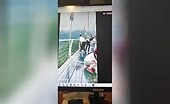 Tourists Fall from Glass Walkway