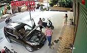 Man Pinned by Car Against Wall