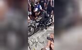 Motorcyclist Crashes Into Crowd