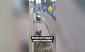 Motorcyclist Falls Under Truck