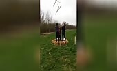 Individuals Throwing Swords Into Air