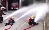 Firefighter knocked down by hose blast