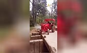 Tractor tips into ditch, man climbs out