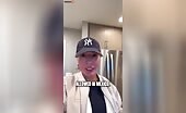 Man in cap points and shouts during indoor outburst