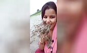 Woman Consumes Field Mud Slurry