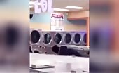 Woman Attempts to Catch Heavy Object