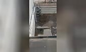 Workers Pump Water Out Of Construction Site